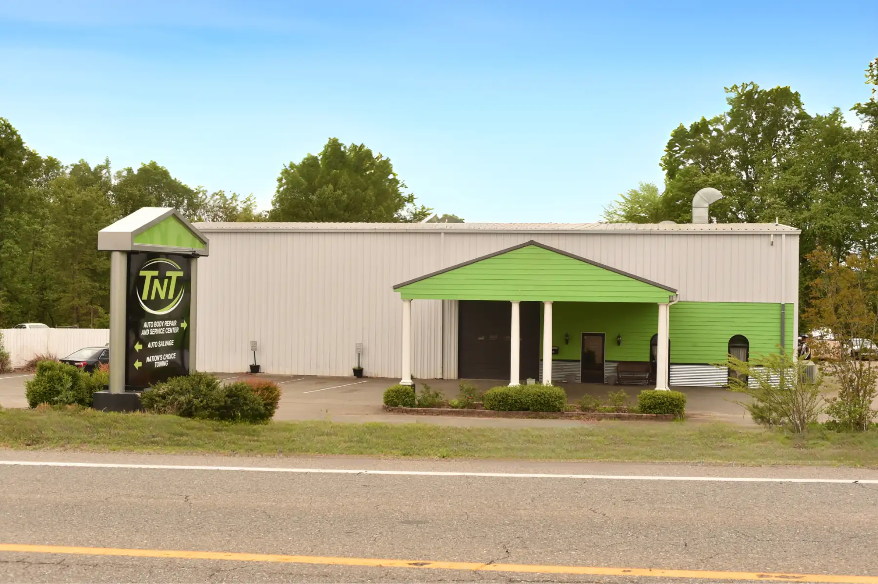 TNT auto exterior building near road.